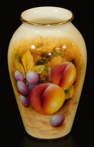 A Royal Worcester porcelain vase, of shouldered form, handpainted with autumnal fruits, shape no. G461, 1962, indistinctly signed, 11cm H.