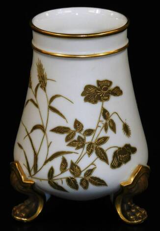 A late 19thC Royal Worcester vase, of circular form, raised with gilt coloured wheat and leaves, on hairy paw feet with an upper fixed gilt banding, green printed mark beneath, 14cm H.