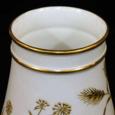 A late 19thC Royal Worcester vase, of circular form, raised with gilt coloured wheat and leaves, on hairy paw feet with an upper fixed gilt banding, green printed mark beneath, 14cm H. - 3