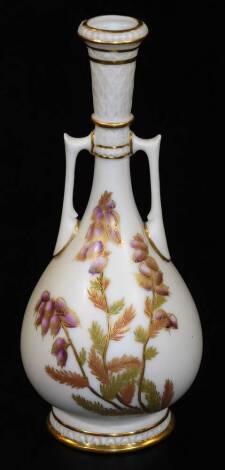 A Royal Worcester blush ivory slim necked vase, decorated with heather in puce, red and green, shape code 942, c1890, 17cm H.