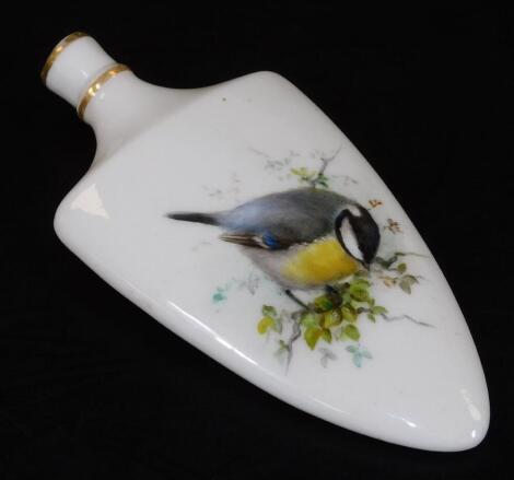 An early 20thC Royal Worcester porcelain perfume bottle, of shield form, handpainted with a blue tit and flowers to the reverse, printed marks, 9cm H.