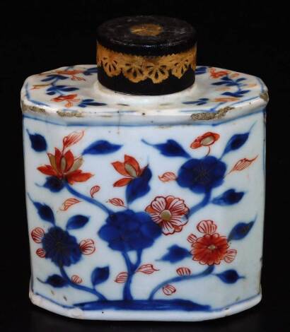 An 18thC Chinese Imari porcelain tea caddy, decorated with flowers, of octagonal form with metal lid, unglazed base, 12cm H.