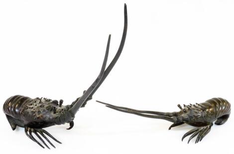 A pair of Japanese bronze figures of crayfish, each in differing poses, with textured undersides, unmarked, possibly Meiji period, 23cm H. (2)
