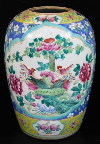 A Chinese porcelain ovoid jar, decorated with panels of birds, in famille rose colours, surrounded by flowering branches, predominantly in pink, green and white, on a blue ground, unmarked, 32cm H.