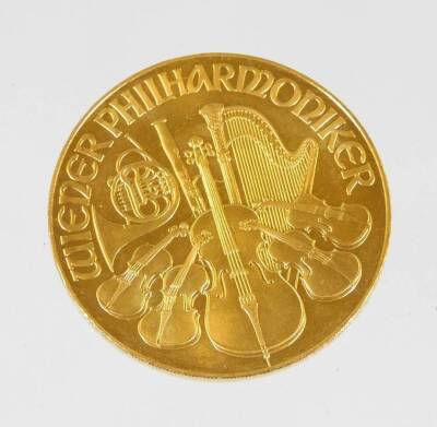 A 1992 Austrian gold Philharmonic coin, marked 1 unze gold, 999.9, 2000 Schilling. - 2