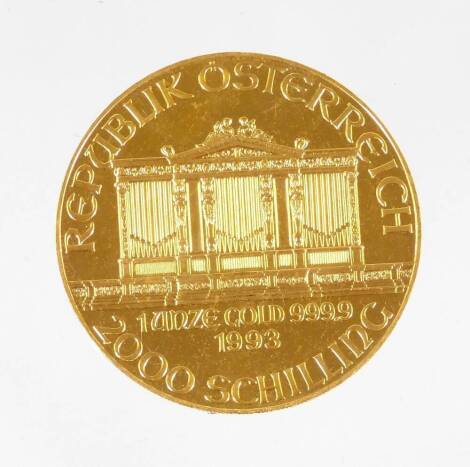 A 1993 Austrian gold Philharmonic coin, marked 1 unze gold, 999.9, 2000 Schilling.