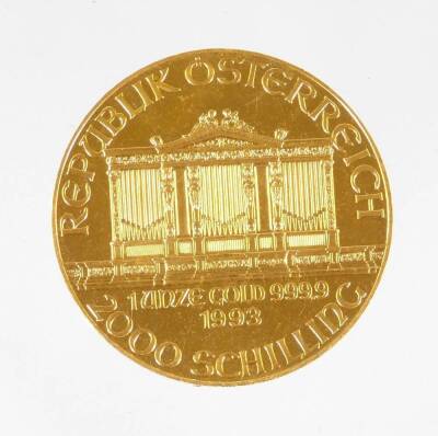 A 1993 Austrian gold Philharmonic coin, marked 1 unze gold, 999.9, 2000 Schilling.