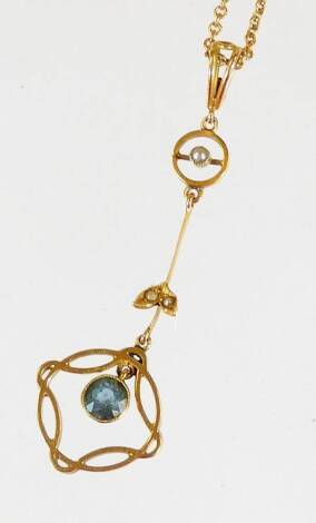 A Victorian pendant and chain, the drop pendant set with pale blue stone and seed pearl, in two tier drop design, yellow metal, marked 15ct, on a fine link chain, marked 15ct, the pendant 5.5cm high, 5.5g all in.