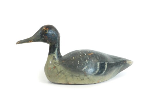 A painted pine folk art duck, probably French, in black orange and white colour way, possibly 19thC, 39cm W.