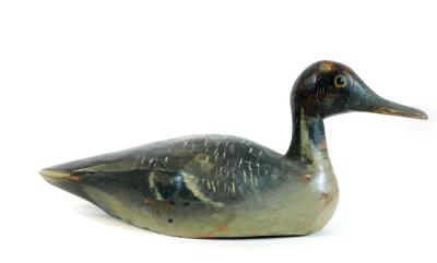 A painted pine folk art duck, probably French, in black orange and white colour way, possibly 19thC, 39cm W. - 2