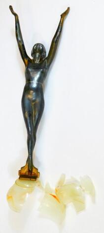 A 1930s Art Deco metal figure of a nude lady, with arms upright, on a shaped base with partial glazed dome, numbered PAT DES 80059, 6cm H. (the glassware AF)