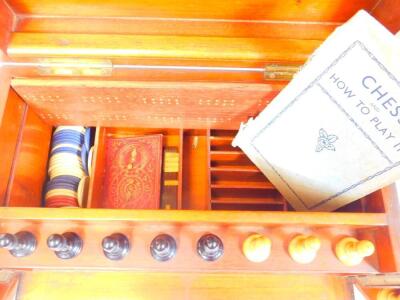 A late 19thC mahogany cased games compendium, containing chess set in the Staunton style with 7.5cm H white king, a lift off tray with dominoes, associated ephemera, etc. when closed 18cm H, 33cm W, 21cm D. - 2