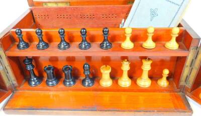 A late 19thC mahogany cased games compendium, containing chess set in the Staunton style with 7.5cm H white king, a lift off tray with dominoes, associated ephemera, etc. when closed 18cm H, 33cm W, 21cm D. - 3