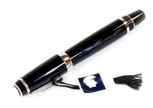 A Montblanc Boheme fountain pen, black with chrome coloured clip and banding, with star to the lid, label card, 7cm W.