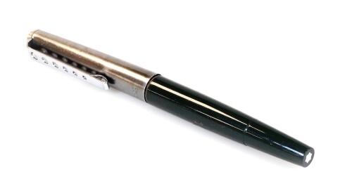 A Montblanc fountain pen, the lid marked Carrera in green and polished steel colours, with graduated pieced clip, with star to the top of the lid and partially enclosed, 13cm W.