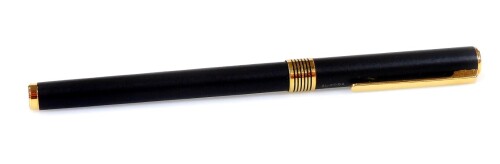 An Aurora Marco Polo fountain pen, in black with gilt coloured banding and clip, open nib, 14cm W.