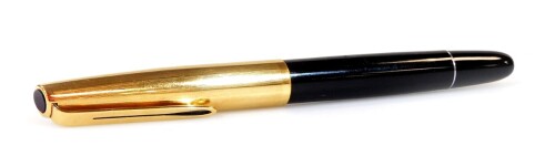 An Aurora 88 fountain pen, marked 88p, in black with chrome coloured banding, gilt coloured clip and lid and black circle to the top, 13cm W.