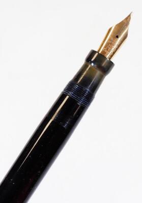 A Parker Duofold Lucky Curve fountain pen, in black with gilt banding and clip, with named nib, marked 14k, 15cm W. - 2