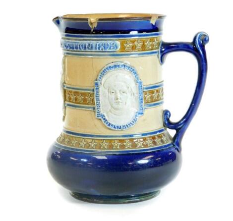 A Royal Doulton Lambeth stoneware World Colombian Exposition 1893 commemorative jug, raised with eagle flags and medallions with bulbous body, thumb mould handle and circular foot, impressed marks beneath, 20cm H. (AF)