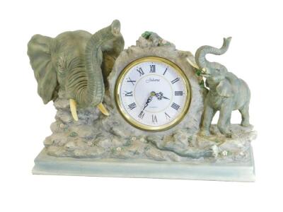 A Juliana novelty quartz clock, set with resin elephants, with a 13cm Dia. Roman numeric dial, 43cm W.