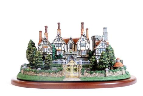 A Danbury Mint cottage figure group Georgian Mansion, 27cm W, with certificate, other ephemera and outer packaging.