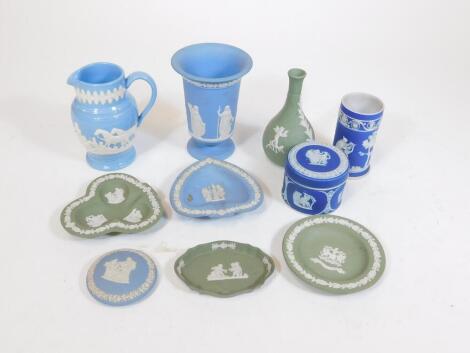 A collection of Jasper ware, Wedgwood and others, to include a cylindrical dark blue vase, 10cm H, raised with classical figures, marks beneath, green Wedgwood, Dudson and others, etc. (a quantity)