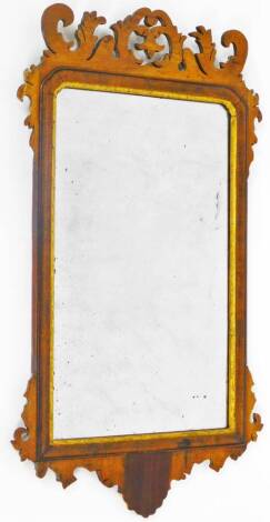 A 19thC mahogany fret mirror, in carved case with shaped glass, with gilt coloured moulded outline, 70cm H, 43cm W.