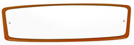 A G-Plan style teak mirror, of shaped form, with plain glass, 30cm H, 95cm W, 4cm D.