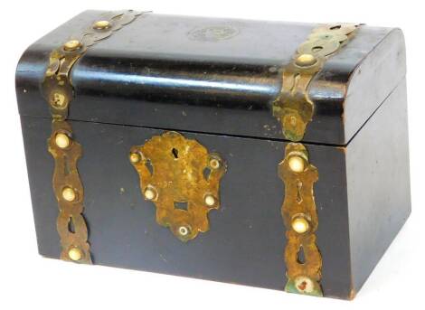 A 19thC ebonised domed top casket, set with circular sections with an elaborate escutcheon and plain interior, 16cm H, 25cm W, 13cm D. (AF)