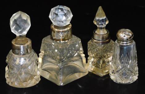 Various cut glass bottles, with silver stoppers, to include a tapering square example with orb stopper, 11cm H, etc. (a quantity)