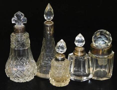 Various dressing table bottles, to include one of cone shape form with silver collar and flame stopper, 16cm H. (5)