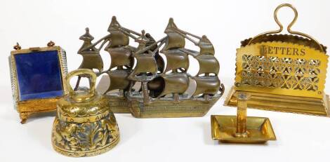 Various metalware, a small metal bell, 9cm H, a glazed ring casket on shaped feet, miniature candlestick, ship bookends and a desk tidy. (a quantity)