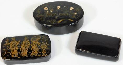 A late 19thC Japanned snuff box, with hinged lid set with figures, 8cm W and two further snuff boxes, one probably polished horn. (3)