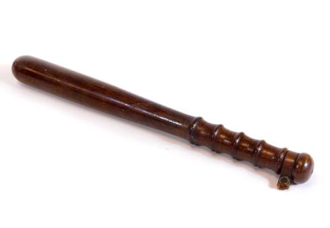 An early 20thC stained oak truncheon, with turned handle and mushroom pummel with part leather strap, 7cm W.