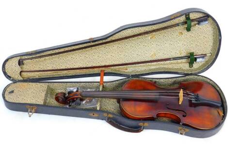 A late 19thC violin, with one piece figured back, the back measures 35.5cm, with two bows and violin case.