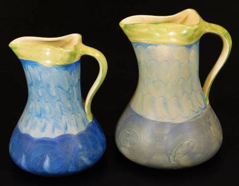 A graduated pair of mid 20thC Myott & Sons pottery jugs, no. 8509, each in blue and green striped pattern, 22cm H, etc. (2)