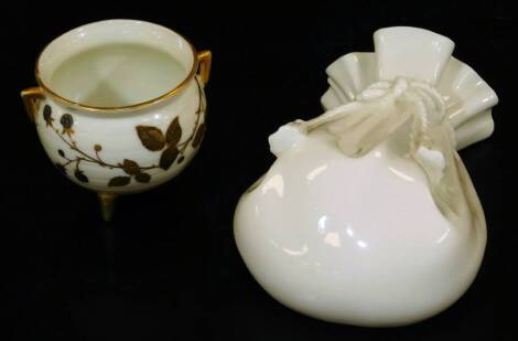 A Royal Worcester blush ivory cauldron, decorated with blackberries, c1880, 7cm H, together with a white glazed wall pocket in the form of a bag, c1880, 15cm H. (2)