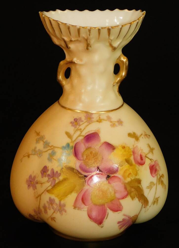 A Royal Worcester blush ivory bulbous vase, decorated with flowers 