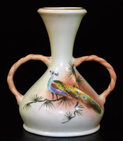 A Royal Worcester Locke & Co two handled blush ivory vase, decorated with a peacock, green Locke & Co mark, c1890, cm H.