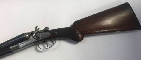 A 12 bore side by side shotgun, marked James & Co Birmingham, serial number 129353. Auctioneer's note: to purchase this lot you must have a current and valid shotgun certificate.