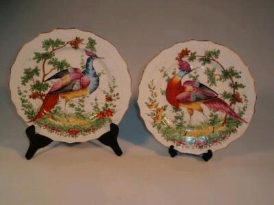 A pair of 18thC-style plates with hand painted bird decoration