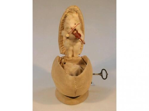 An early 20thC musical automaton modelled as a fur covered rabbit emerging