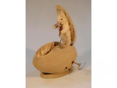 An early 20thC musical automaton modelled as a fur covered rabbit emerging - 2