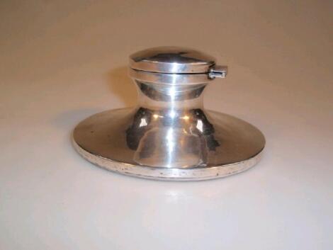 A silver Capstan ink well