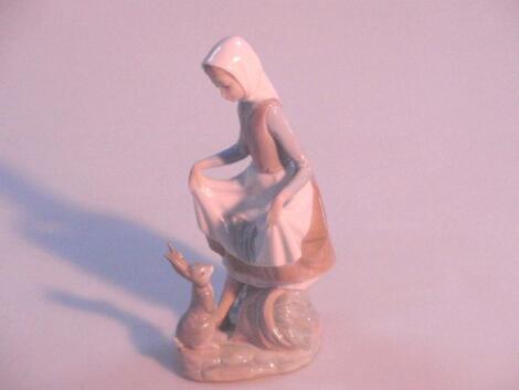 A Lladro figure of a country girl with a hare