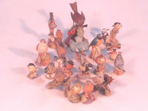 A collection of fourteen Royal Worcester bisque porcelain figures of birds