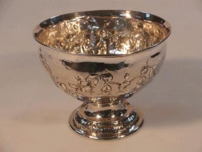 A silver rose bowl, repouss? with trailing flowers and foliage, engraved