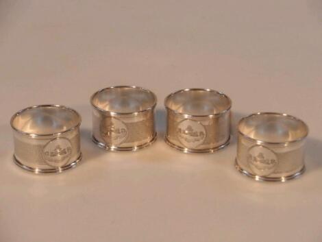 A set of four George V silver napkin rings