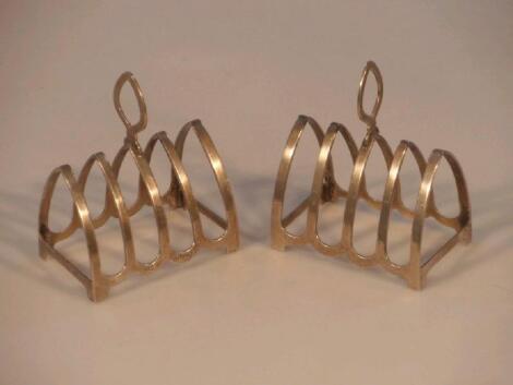 A pair of George V silver five-bar toast racks