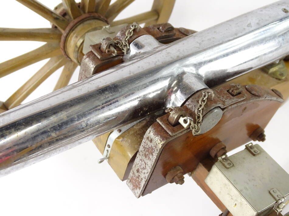A miniature artillery type cannon, with chrome plated barrel, hardwood
